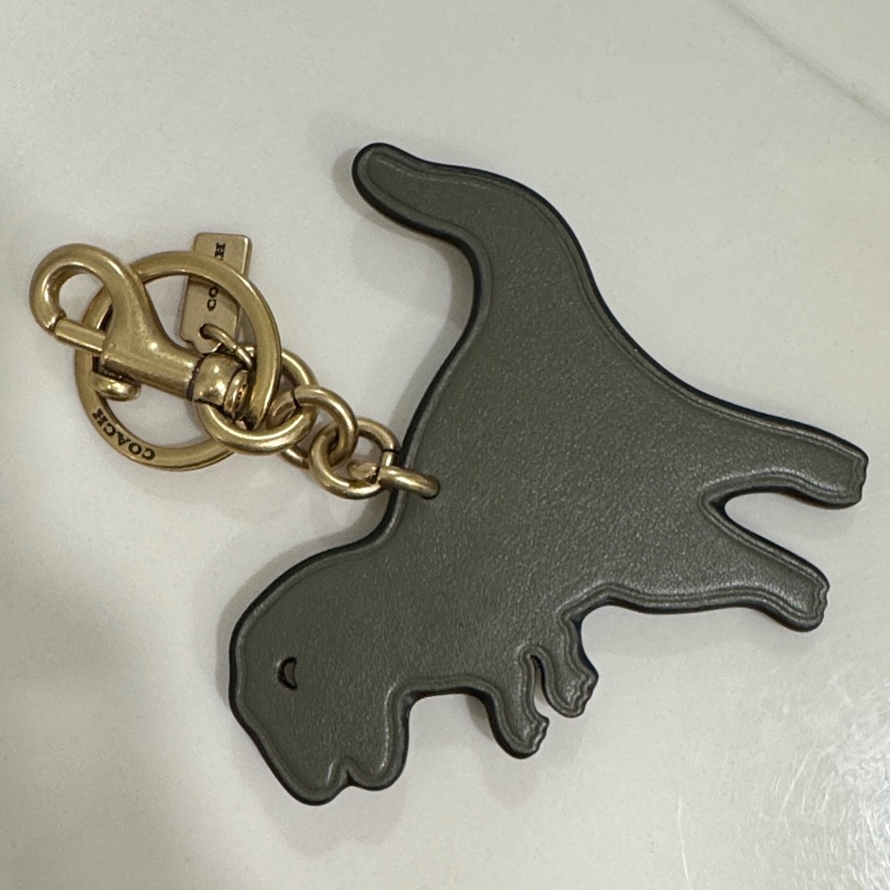 Coach Olive Rexy Dino Charm